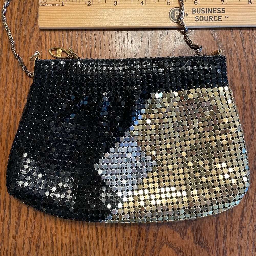 Black and silver clutch with strap